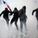 Storefronts close as police in Paris fire tear gas and water cannons on protesters